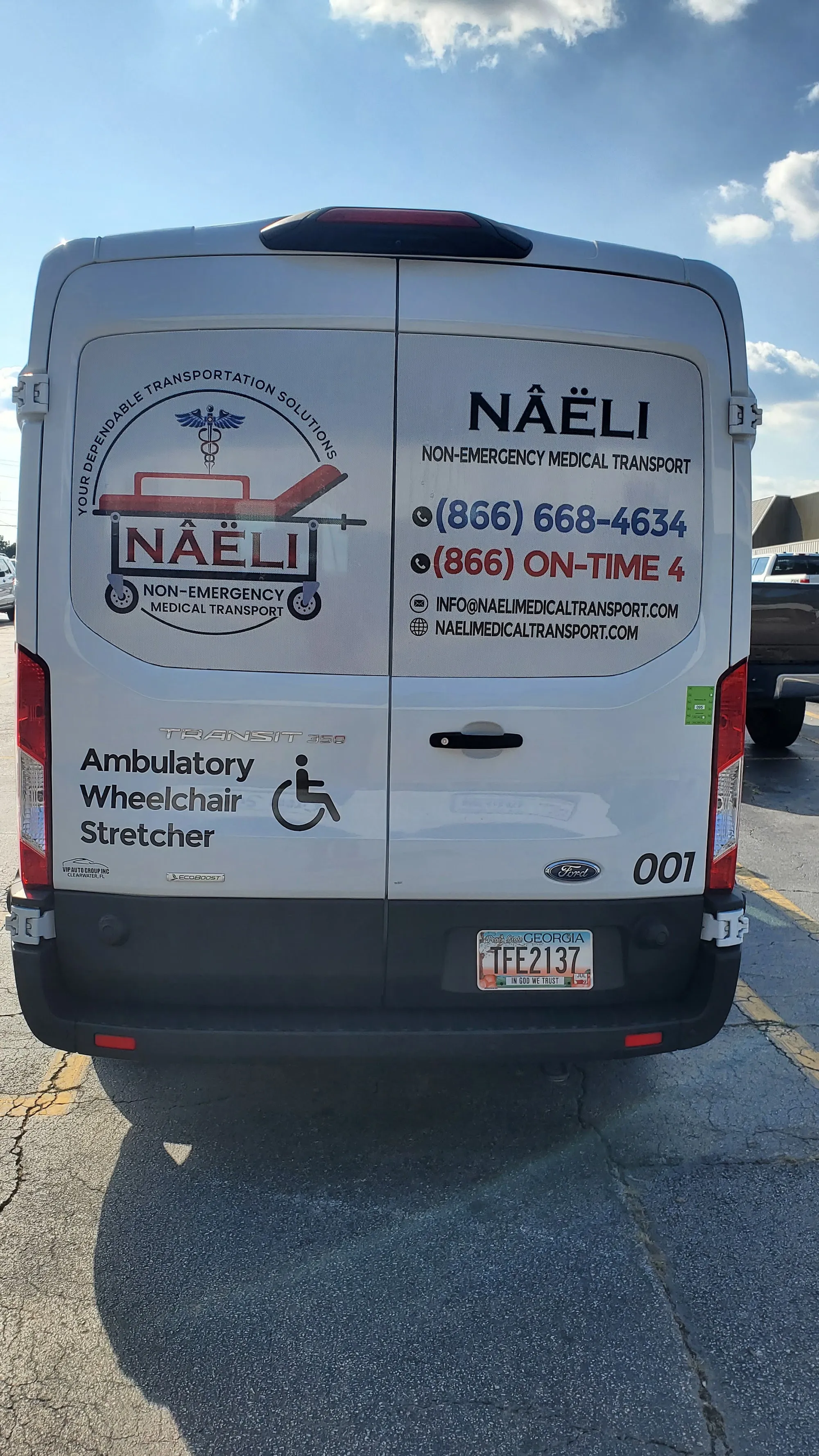 Rear view of a Naeli van marked for ambulatory, wheelchair, and stretcher transport