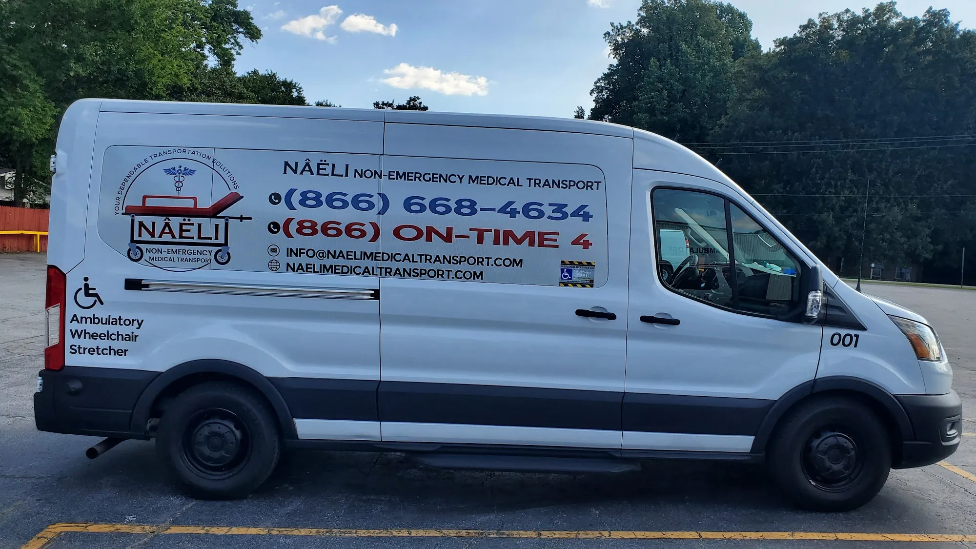A Naeli transport van parked in a lot on a sunny day