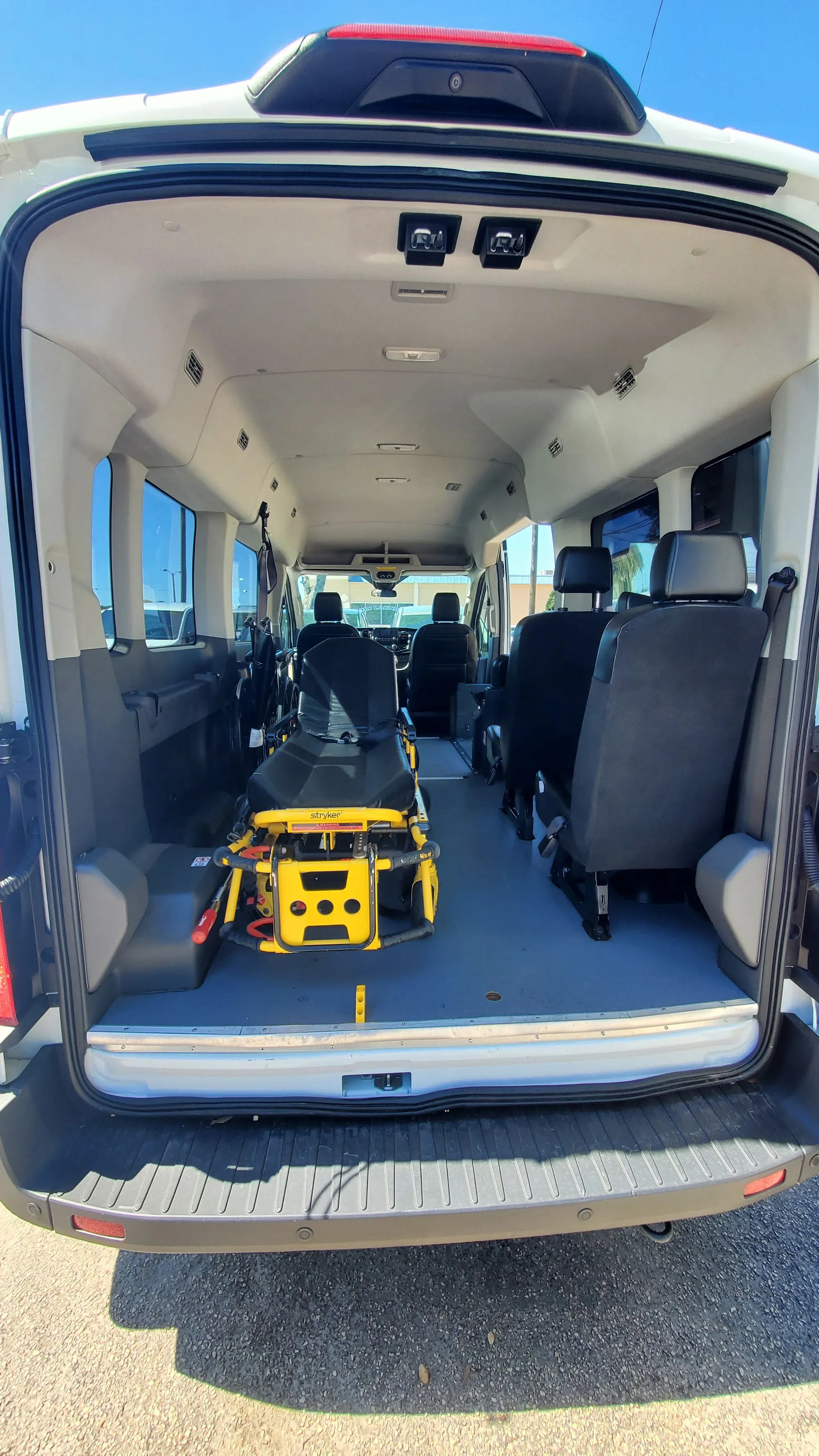 The back of a Naeli transport van with a stretcher secured inside